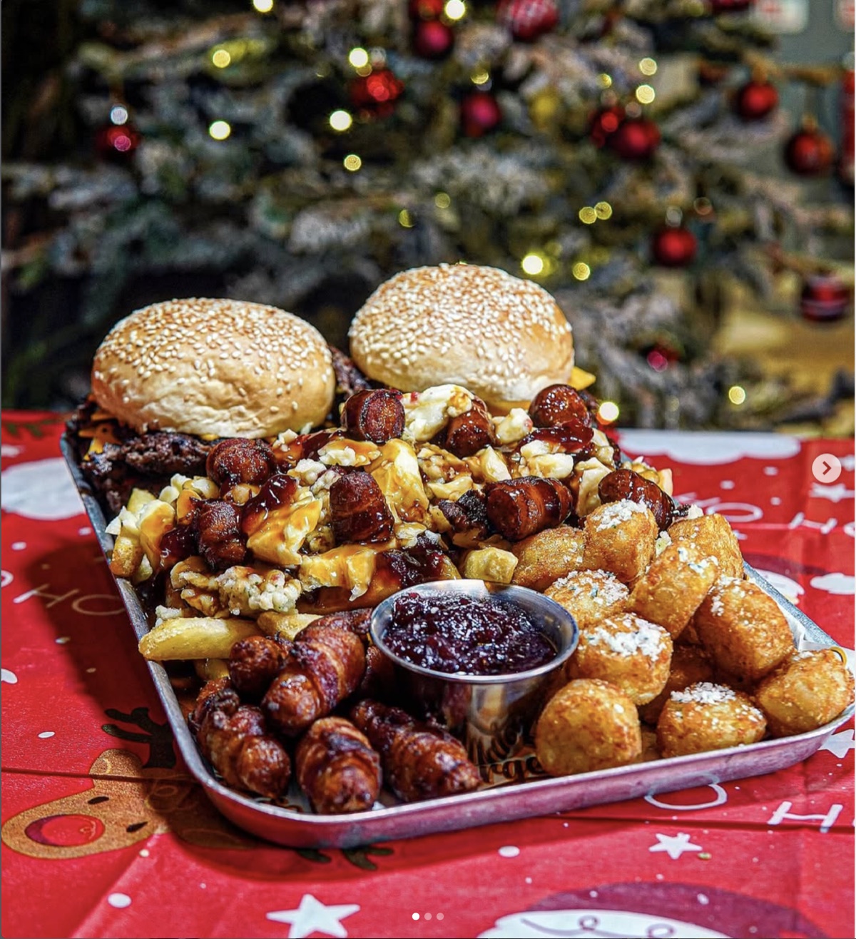 Chuck and Blade Christmas trashy tray with burgers, festive poutine, pigs in blankets and tater tots